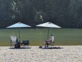 Relaxing under umbrellas on the Russian River 